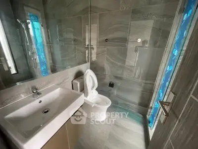 Modern bathroom with sleek fixtures and stylish tile design