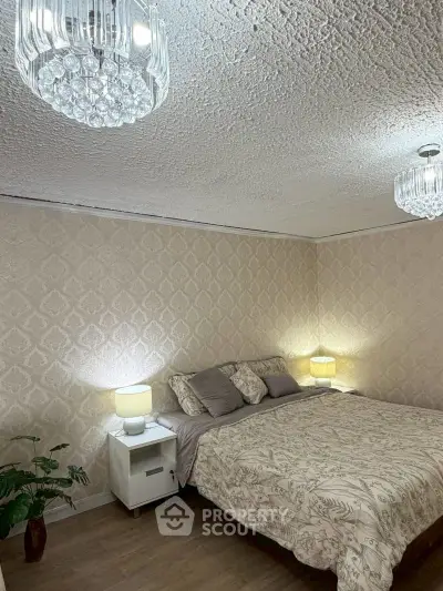 Cozy bedroom with elegant lighting and stylish decor