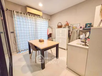 Charming study room with modern furniture and ample natural light.