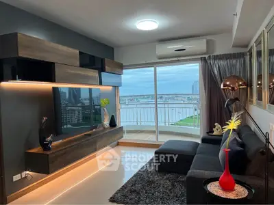 Modern living room with sleek furniture and stunning city view from balcony.