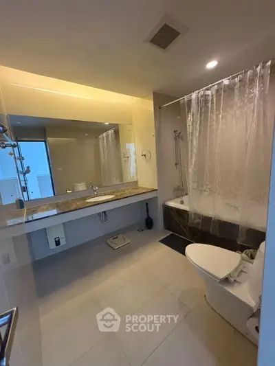 Modern bathroom with elegant fixtures and marble countertop