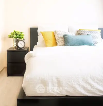 Bright and cozy bedroom with stylish decor and comfortable bedding