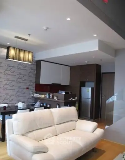 Modern living room with open kitchen and stylish decor