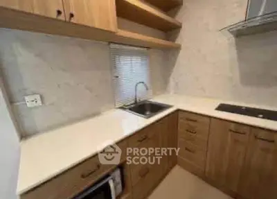 Modern kitchen with wooden cabinets and sleek countertops