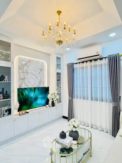 Luxurious living room with elegant chandelier and modern decor