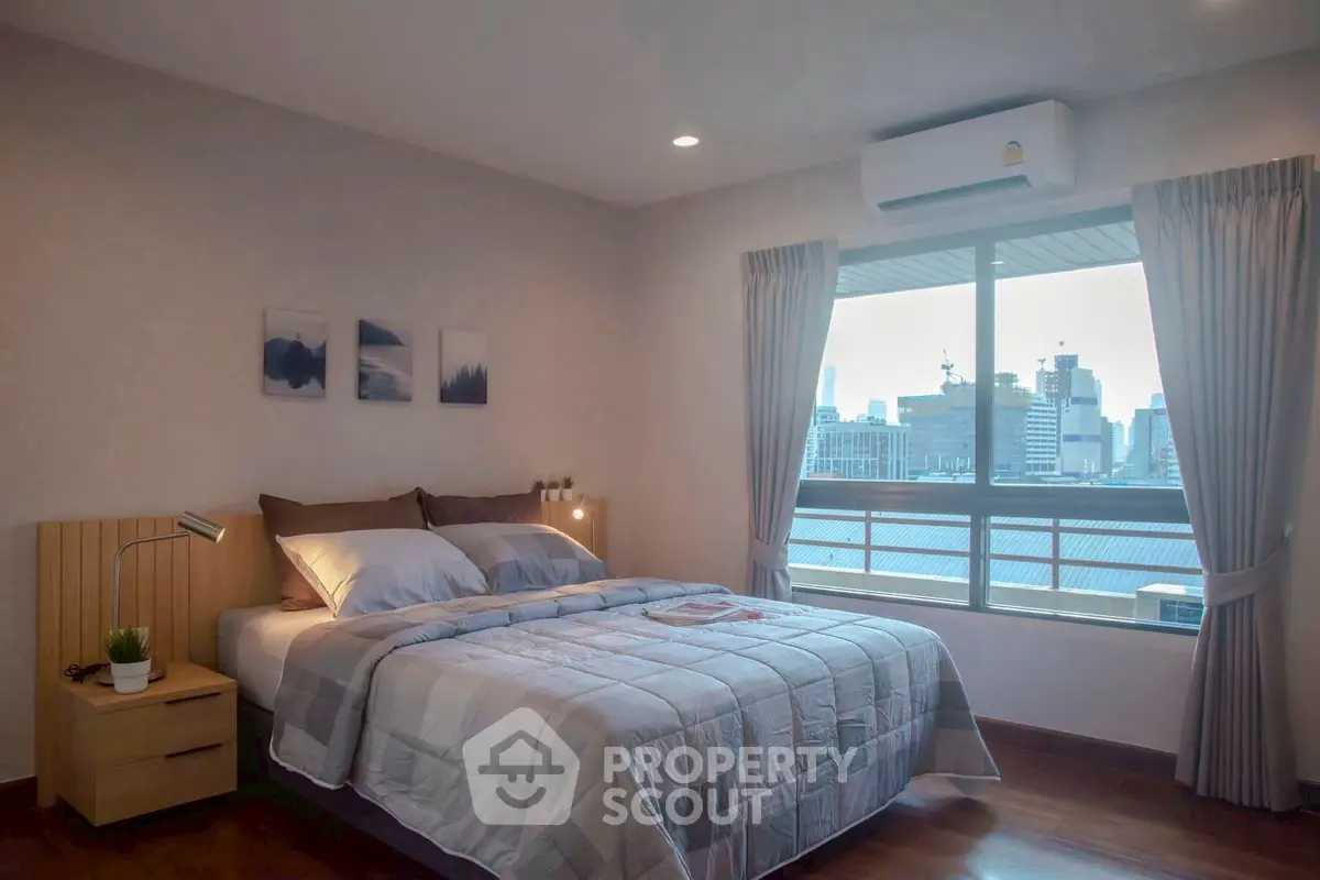 Cozy bedroom with city view and modern decor