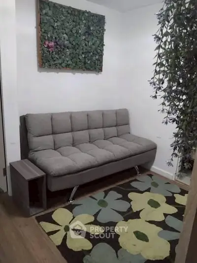 Cozy living room with modern sofa and floral decor