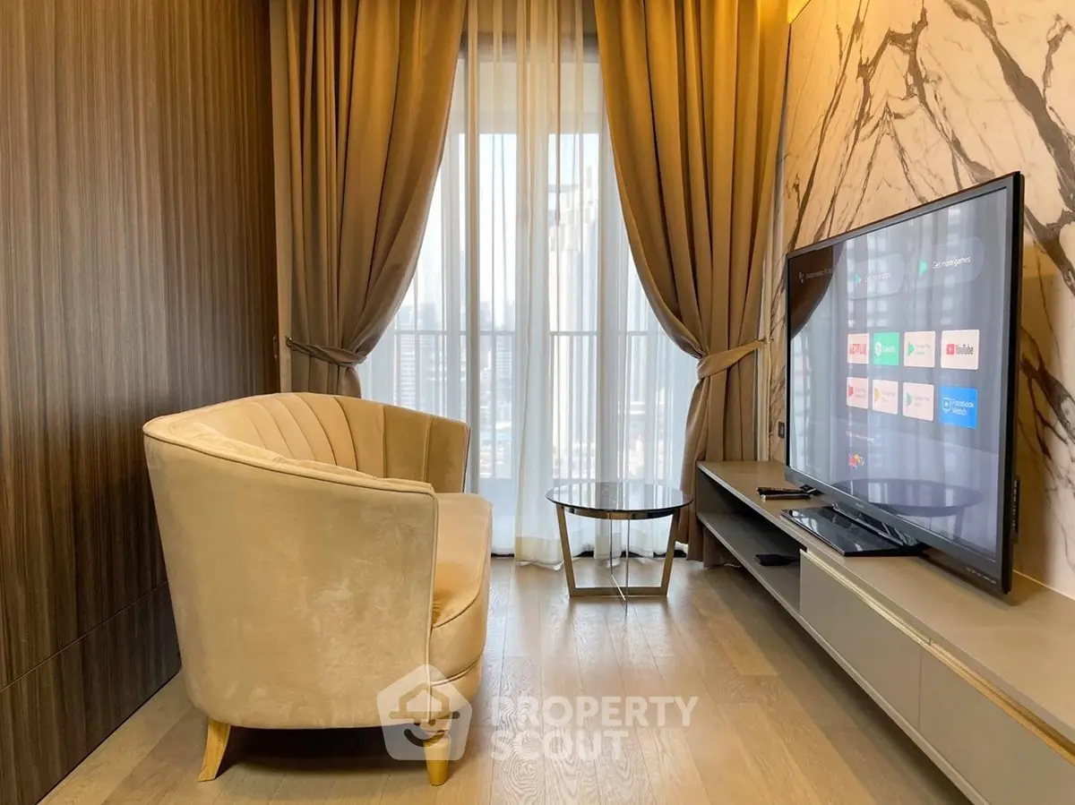 Modern living room with elegant decor and large TV, featuring floor-to-ceiling windows and luxurious curtains.