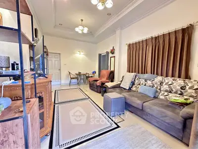 Spacious living room with elegant decor and cozy seating area, perfect for relaxation and entertainment.