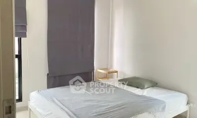 Cozy minimalist bedroom with natural light and simple decor