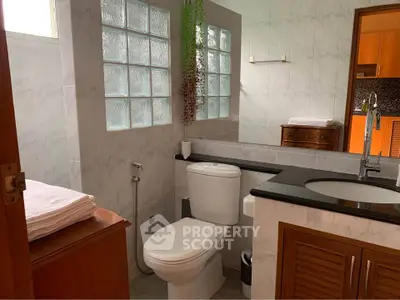 Spacious bathroom with modern fixtures and natural light