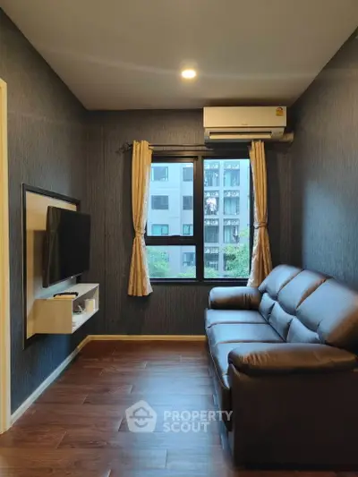 Cozy living room with modern decor and large window view