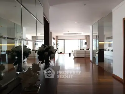 Spacious modern living room with elegant decor and large windows