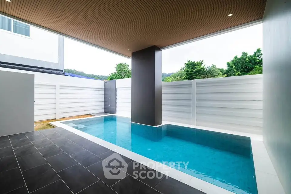 Modern private pool area with sleek design and elegant tiling, perfect for relaxation and entertainment.