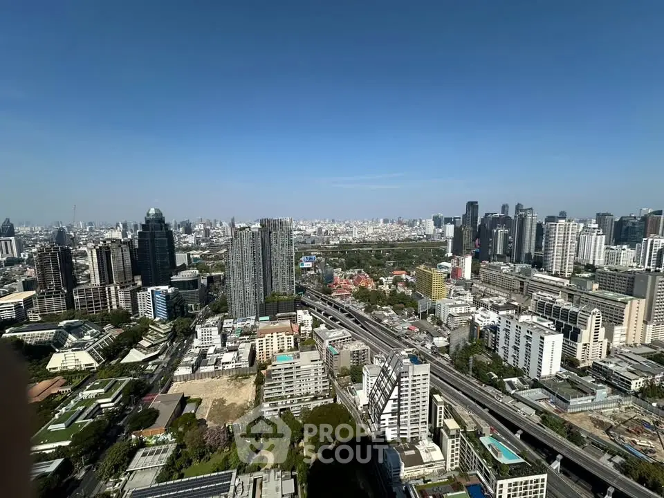 Stunning cityscape view from high-rise building showcasing urban skyline and vibrant city life.