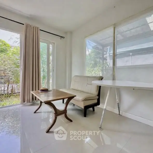 Bright living room with modern furniture and garden view