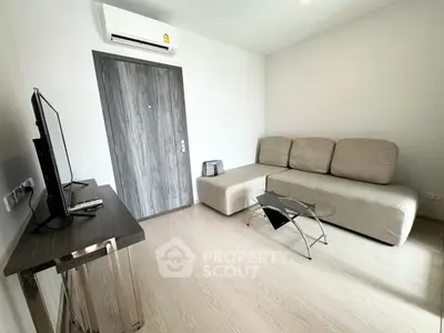 Modern living room with sleek furniture and air conditioning unit