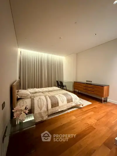 Elegant bedroom with modern furniture and warm lighting