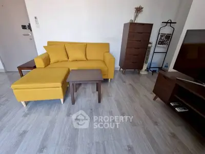 Modern living room with yellow sofa and wooden furniture, perfect for cozy gatherings.