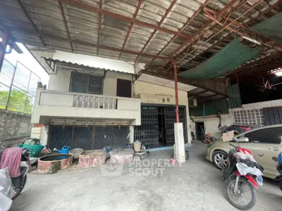 Spacious residential property with covered parking and unique architectural features.