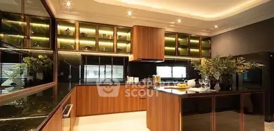 Luxurious modern kitchen with elegant wooden cabinetry and ambient lighting