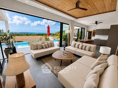 Luxurious open-plan living room with stunning ocean view and modern decor