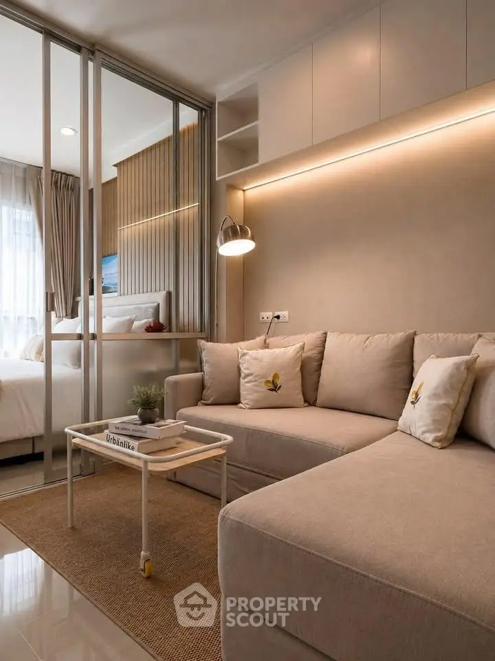Modern living room with cozy beige sofa and stylish lighting in a compact apartment.