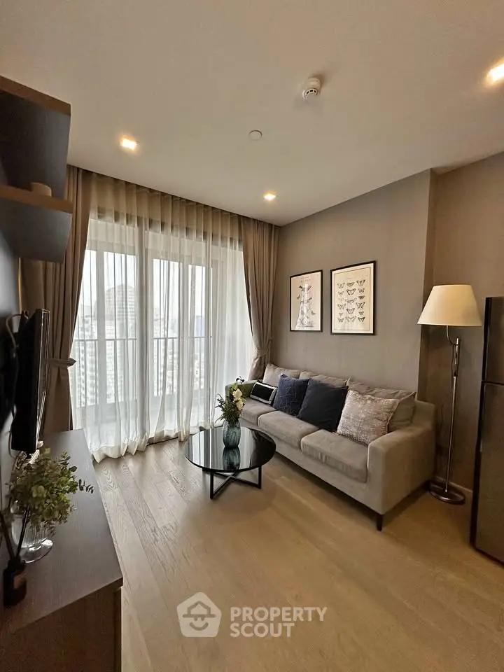 Modern living room with cozy sofa, floor lamp, and large window with city view.