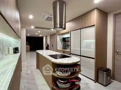 Luxurious modern kitchen with marble countertops and sleek wooden cabinetry