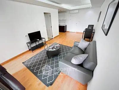 Modern living room with sleek furniture and stylish decor in a cozy apartment.