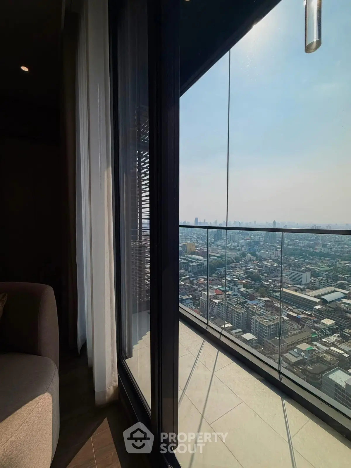 Stunning high-rise balcony view overlooking the city skyline, perfect for urban living enthusiasts.