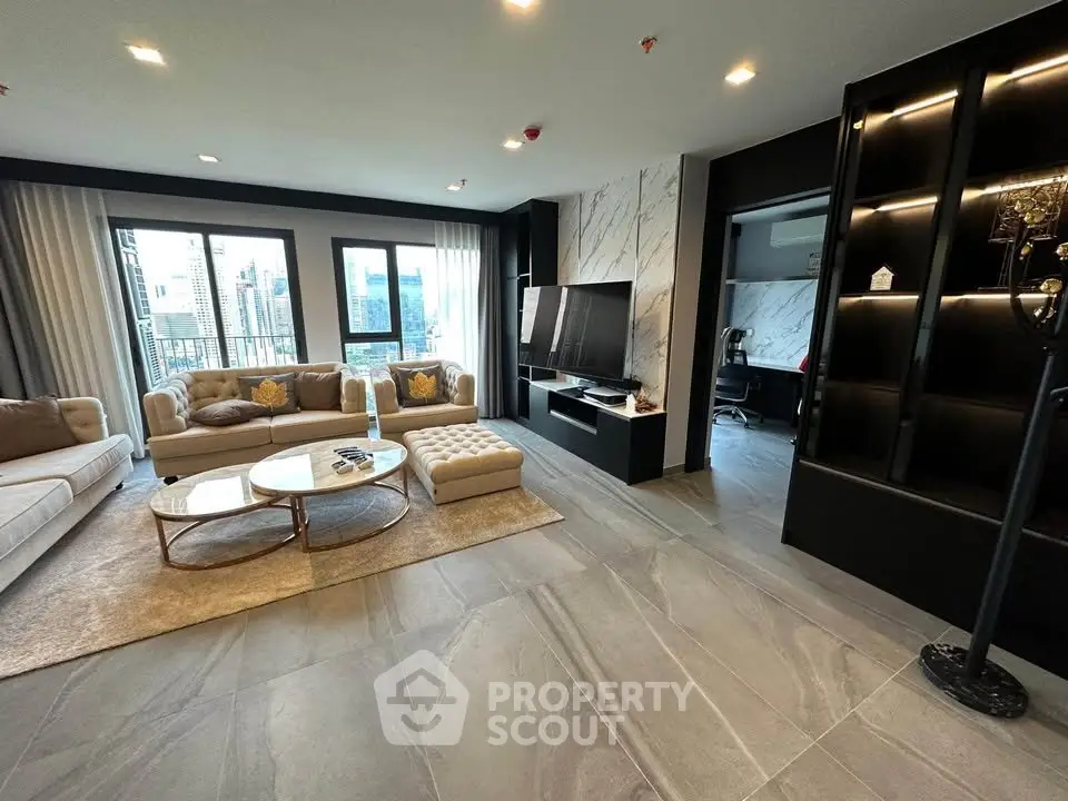 Luxurious modern living room with elegant decor and city view, featuring plush sofas and a sleek entertainment center.