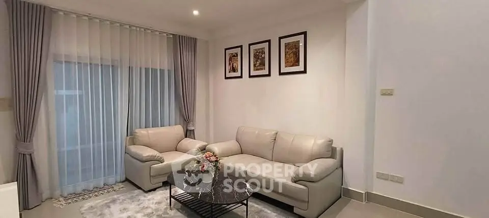 Elegant living room with modern decor and cozy seating area