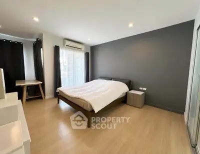 Spacious modern bedroom with sleek design and natural light