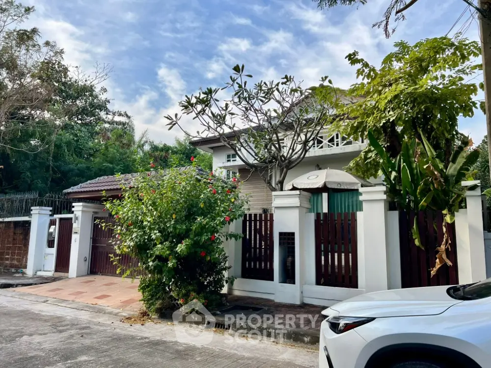 Charming suburban house with lush garden and secure gated entrance