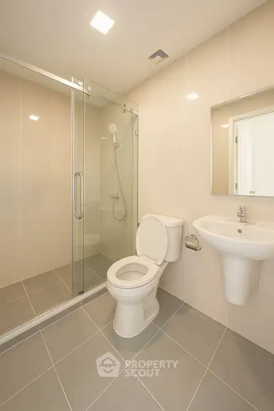 Modern bathroom with glass shower and sleek fixtures