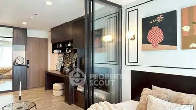 Modern interior with stylish decor and sliding glass partition in a cozy living space.