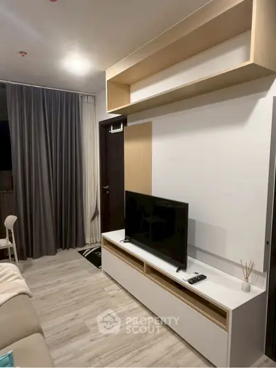 Modern living room with sleek TV unit and stylish shelving