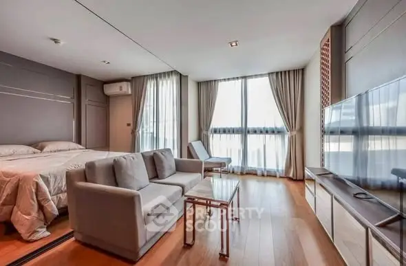 Modern studio apartment with sleek design and ample natural light