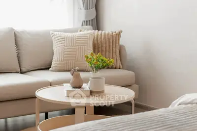 Stylish living room with cozy beige sofa and elegant decor