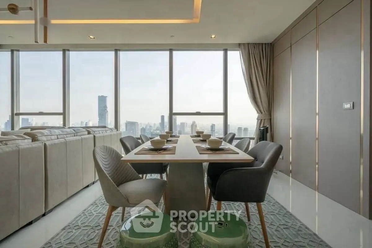 Luxurious dining area with panoramic city views and elegant decor in modern high-rise apartment.