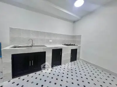 Modern kitchen with sleek design and gas stove in a stylish apartment.