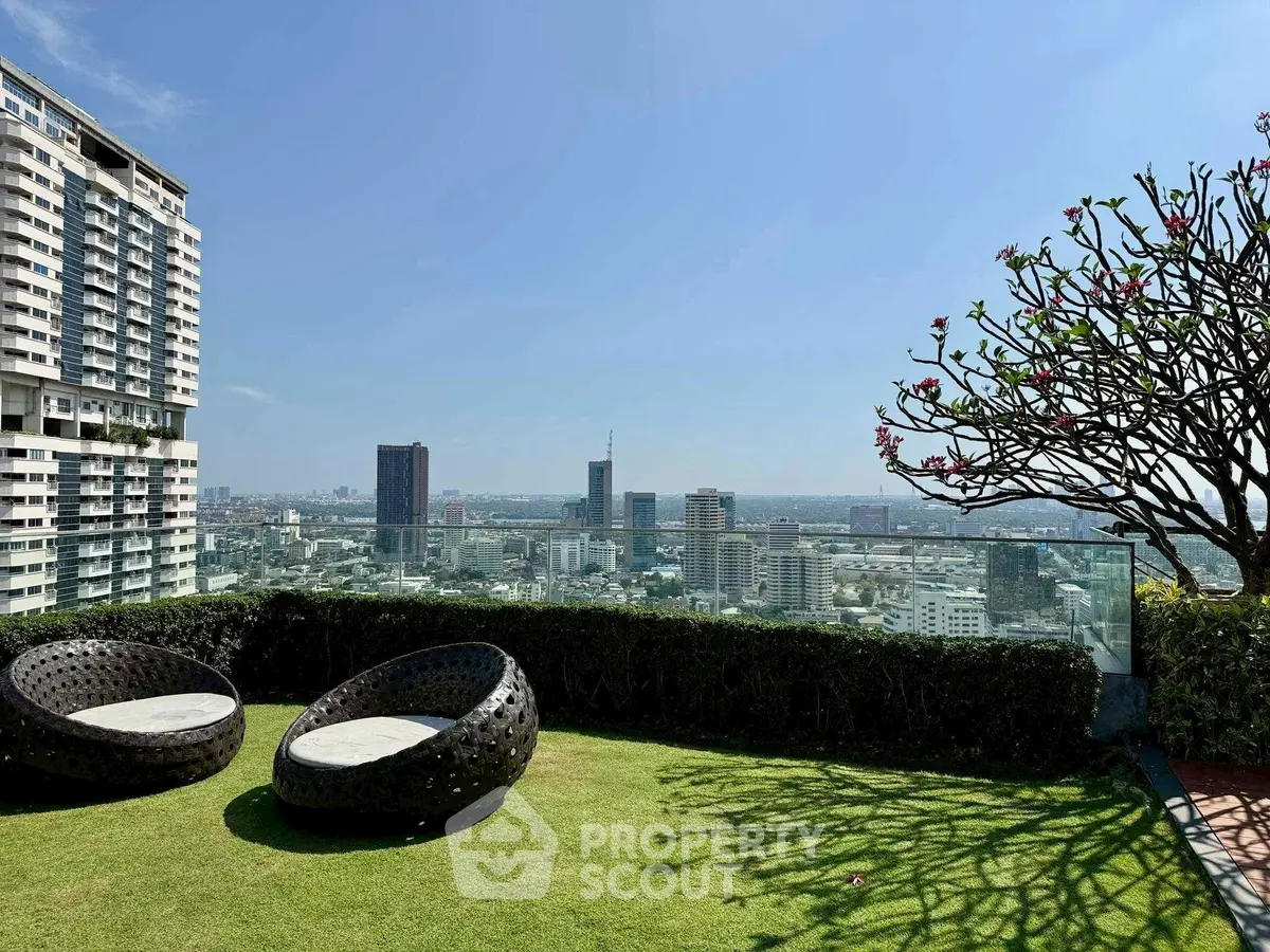 Stunning rooftop garden with panoramic city views and modern seating.