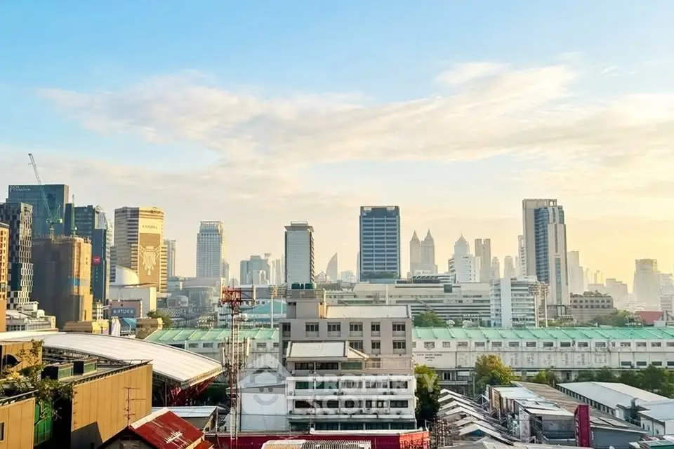Stunning city skyline view with modern high-rise buildings at sunrise, perfect for urban living enthusiasts.