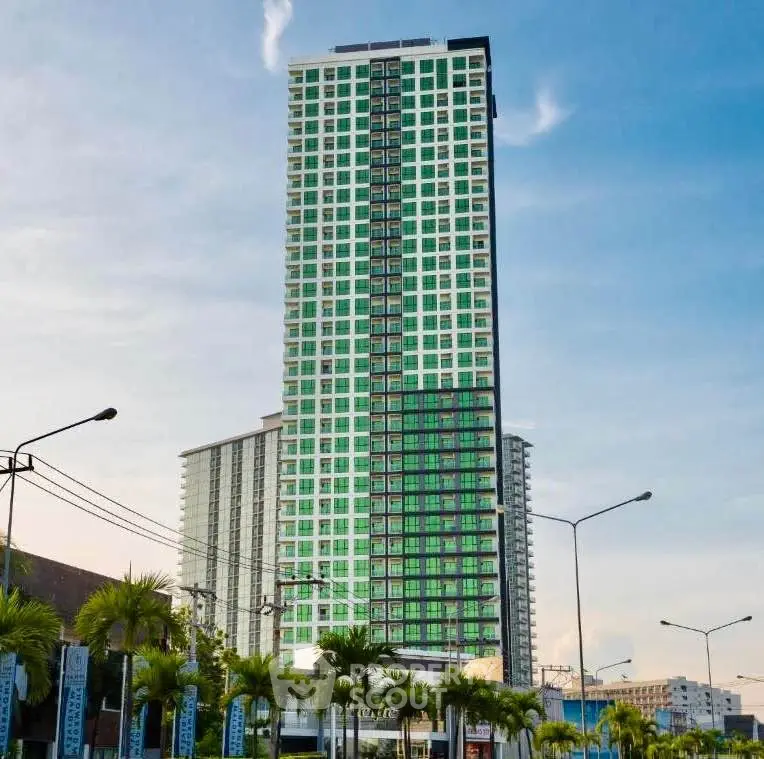 Stunning high-rise building with modern architecture and lush surroundings.