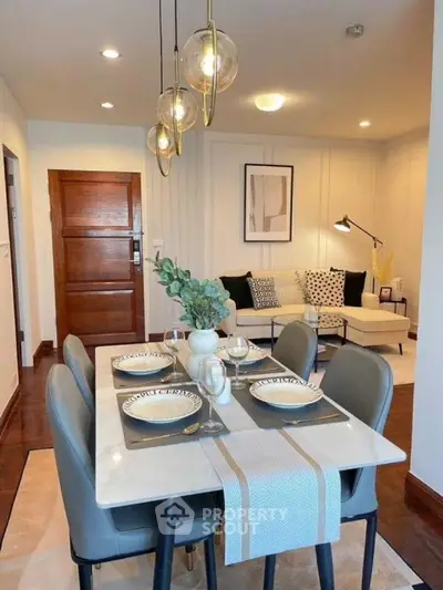 Elegant dining area with modern decor and cozy living room