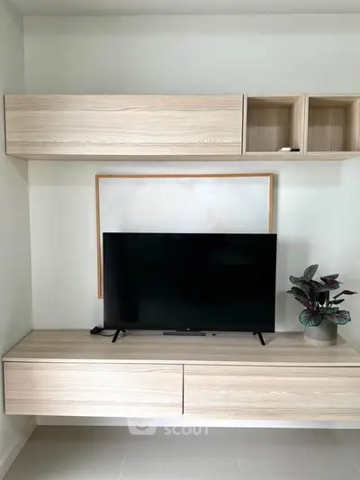 Modern living room with sleek wooden TV console and stylish decor