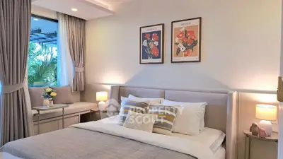 Elegant bedroom with cozy decor and large window view