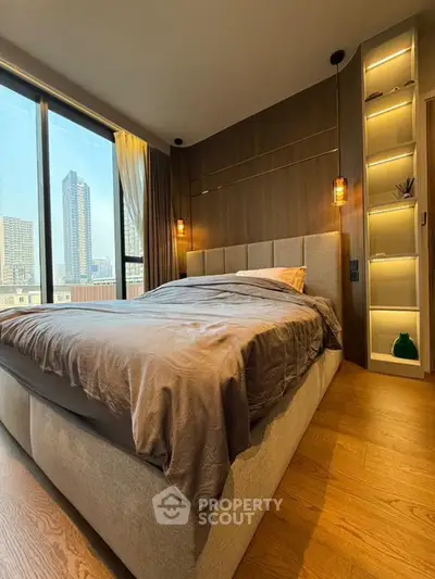 Luxurious bedroom with city view and modern decor in high-rise apartment