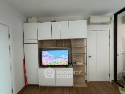 Modern living room with built-in TV cabinet and air conditioning